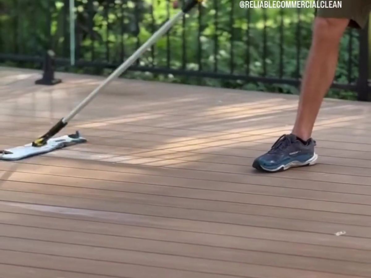 Mopping a timber deck during a new build clean